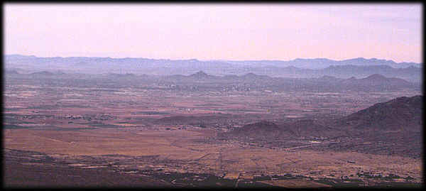 Looking northeast from the Sierra Estrella across the Valley of the Sun, on a cloudy day.